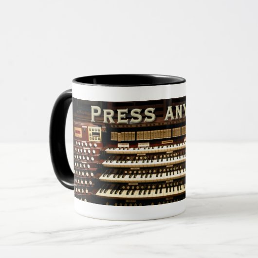 主器官のマグを押して下さい マグカップ (正面左)