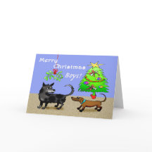 二匹の犬が、クリスマスツリーを持って、後ろの方をかぎ回っています。