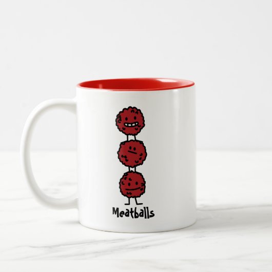 互いの上に積み重なるミートボールのミートボール ツートーンマグカップ (左)