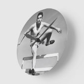 人の飛び越すこと ラウンド壁時計 (傾斜)