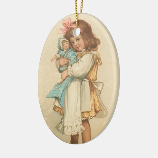 人形を持つヴィンテージのクリスマスの挨拶の女の子 セラミックオーナメント (左)