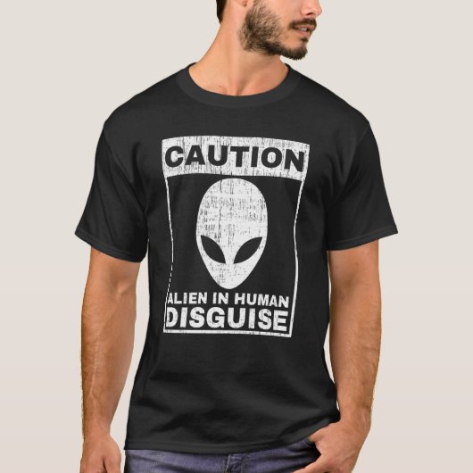 人間の変装のUFOに注意警告的なエイリアン Tシャツ (正面)
