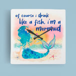 人魚の海 |魚の熱帯性ビーチ スクエア壁時計<br><div class="desc">このおもしろいとMermaid Sea Drink Like a Fish wall clockでトロピカルユーモアをお洒落少し家に追加。ティキのバーやビーチをテーマにした部屋に完璧な追加は、この時計はあなたの装飾に沿岸おもしろいのtouchをもたらす。ビーチにマーメイドが海の夕日を楽しみ、カクテルに「魚のように飲む、私はマーメイド」引用文を搭載し、この時計は自宅におもしろいを少し追加するのに最適な方法である。KLストックによるアート</div>