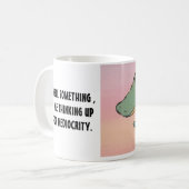 何かを$12.95かげば コーヒーマグカップ (正面左)