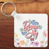 何があなたにもたらすフローラと蝶の引用文 キーホルダー (正面)