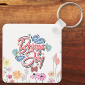 何があなたにもたらすフローラと蝶の引用文 キーホルダー (裏面)