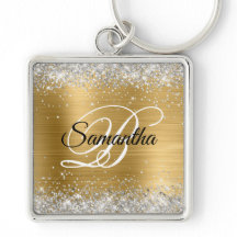 偽のきらきらしたシルバーのグリッターゴールドの箔モノグラム