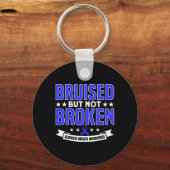 傷ついたが壊れていないサポート脱毛症認識度 キーホルダー (裏面)