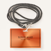 光沢のあるメタリックオレンジ色のテクスチャ黒のアクセント バッジ (正面ランヤード)