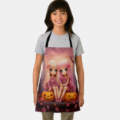 公園のピンクのハロウィーン姉妹の双子の女の子 エプロン (インサイチュ)