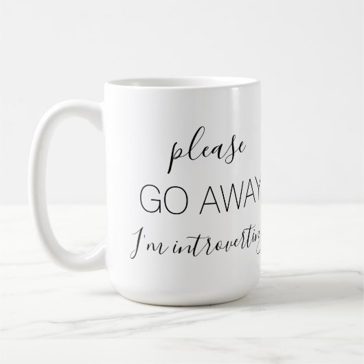 内向的遠くにに行って コーヒーマグカップ (左)