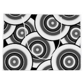 円とリングの幾何学的な白黒パターン ラージペーパーバッグ (裏面)