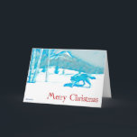 冬の孤狼 - クリスマス カード<br><div class="desc">このスタイリッシュな青一色のイメージには、コウテイボクや山々が雪に覆われた風景を、オオカミ（Canis lupus）が歩いている様子が描かれている。「メリークリスマス」という赤い文字も見える。独自の追加テキストを入力することも可能。</div>