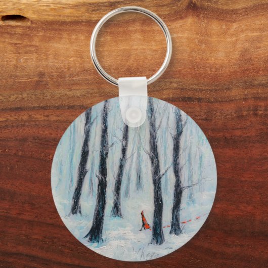 冬の森の中の赤い乗馬フードのような姿 キーホルダー (正面)