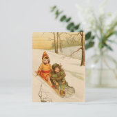 冬の雪のそり姿の女の子 ポストカード (スタンド正面)