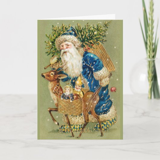 冬の雪の中で鹿とクリスマスプレゼントを持つサンタ シーズンカード (正面)