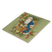 冬の雪の中で鹿とクリスマスプレゼントを持つサンタ タイル (側面)