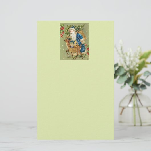冬の雪の中で鹿とクリスマスプレゼントを持つサンタ 便箋 (スタンド正面)