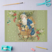 冬の雪の中で鹿とクリスマスプレゼントを持つサンタ 薄葉紙 (クラフト)