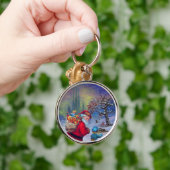 冬の雪の中のおもちゃと子供を持つサンタ キーホルダー (手)