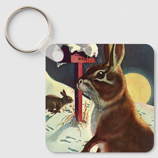 冬の雪の中のウサギたち キーホルダー (正面)