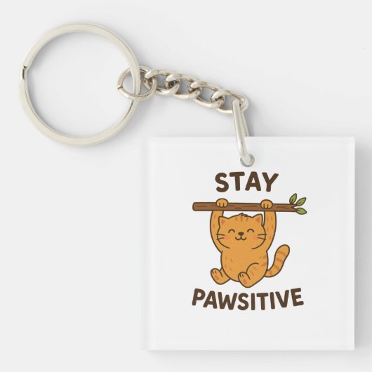 前向きな気持ちを保つ"Stay pawsitive" 引用符 プリント キーホルダー (正面)