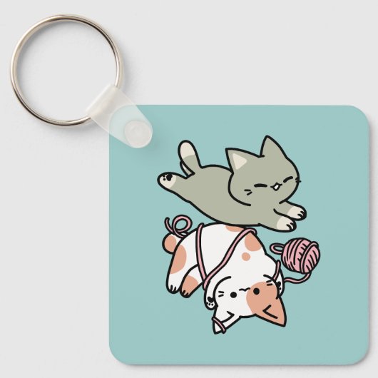 前足で遊ぶ猫のかわいいイラスト キーホルダー (正面)