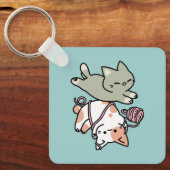 前足で遊ぶ猫のかわいいイラスト キーホルダー (正面)
