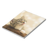 前足を伸ばした可愛い子猫 ノートパッド (回転)