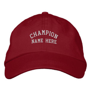 前面に「Champion」と「Name Here」の文字が入ったバイザー 刺繍入りキャップ