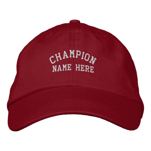 前面に「Champion」と「Name Here」の文字が入ったバイザー 刺繍入りキャップ (正面)