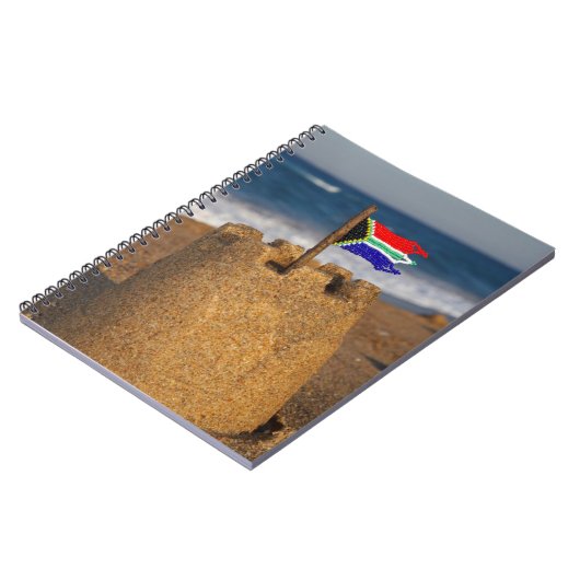 南アフリカ国旗を掲げた砂城、ウムランガ ノートブック (左側)