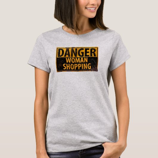 危険女性ショッピング – 金おもしろい属警告標識 Tシャツ (正面)
