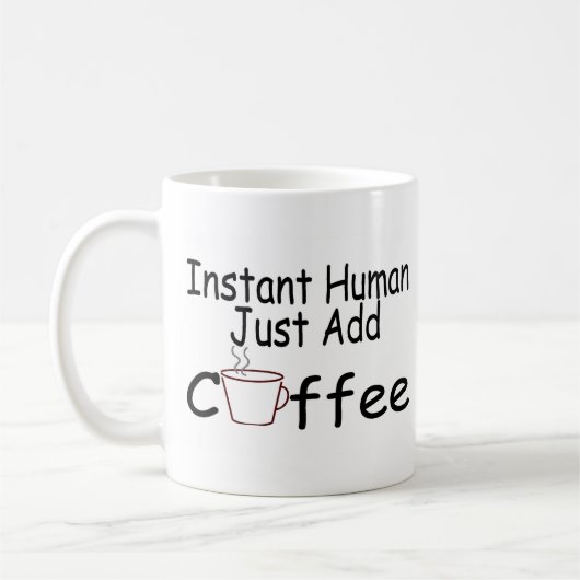 即刻の人間はちょうどコーヒーを加えます コーヒーマグカップ (左)