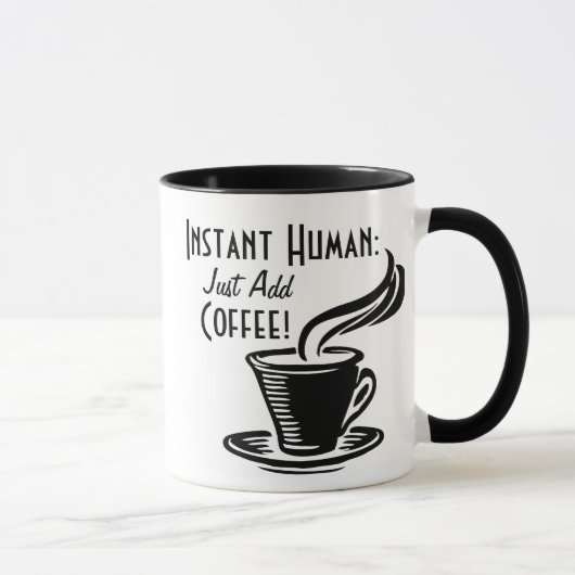 即刻の人間はちょうどコーヒーを加えます マグカップ (右)