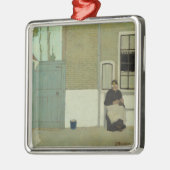 古いオランダの女性が彼女の家の前に(ヤンマンクス) メタルオーナメント (左)