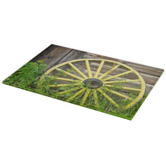 古い歴史的な古い金ゴールドの町を荷馬車の車輪 カッティングボード (角)