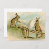 古く旧式なヴィンテージのハッピーイースターのウサギおよび卵 シーズンポストカード (正面/裏面)