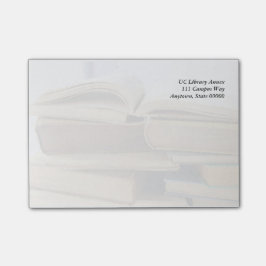 古書の山、開いた1 ポストイット