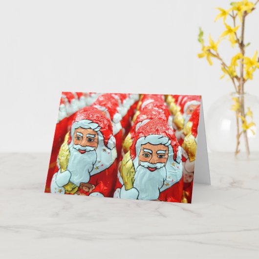 可愛いおもしろいサンタがクリスマスを見ている カード (黄色い花)