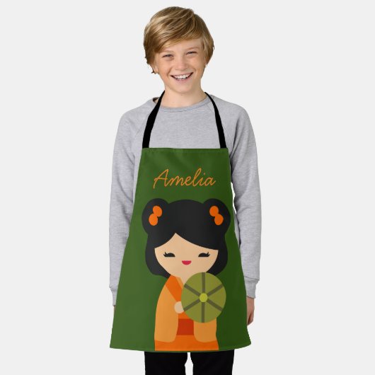 可愛いオレンジコケシ日本のの人形 エプロン (着用した状態)