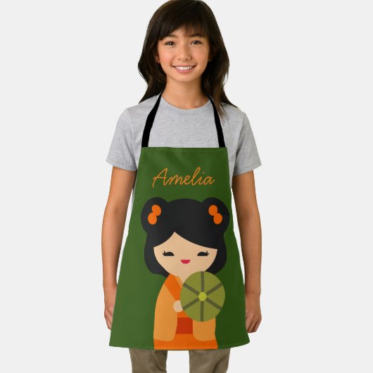 可愛いオレンジコケシ日本のの人形 エプロン (インサイチュ)