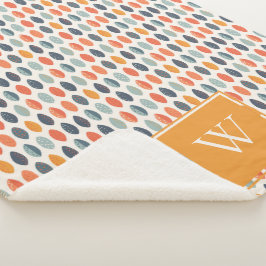 可愛いオレンジ色の青い葉の植物性モノグラムパターン シェルパブランケット