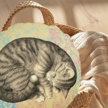 可愛いキルトの上で寝ている猫