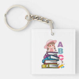 可愛い女の子が本とアルファベットを読んでいるキーチェーン キーホルダー