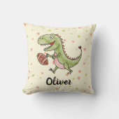 可愛い恐竜遊のフットボールパーソナライズされた クッション (正面)