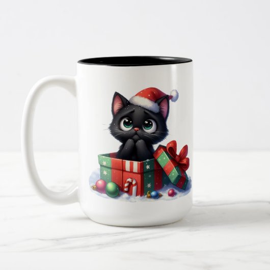 可愛くておもしろい黒いクリスマス子猫 ツートーンマグカップ (左)