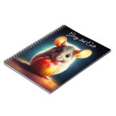 可愛らしい小さな齧歯動物が赤いリンゴを閉じて保持 ノートブック (左側)