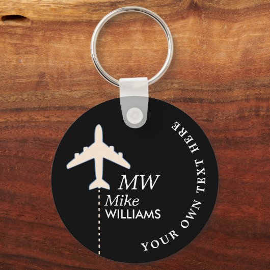 名前の付いた黒いキーチェーン上の白い飛行機 キーホルダー (正面)