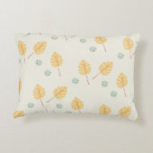 名前をカスタムするオレンジ色の熱帯葉性クリーム アクセントクッション (裏面)